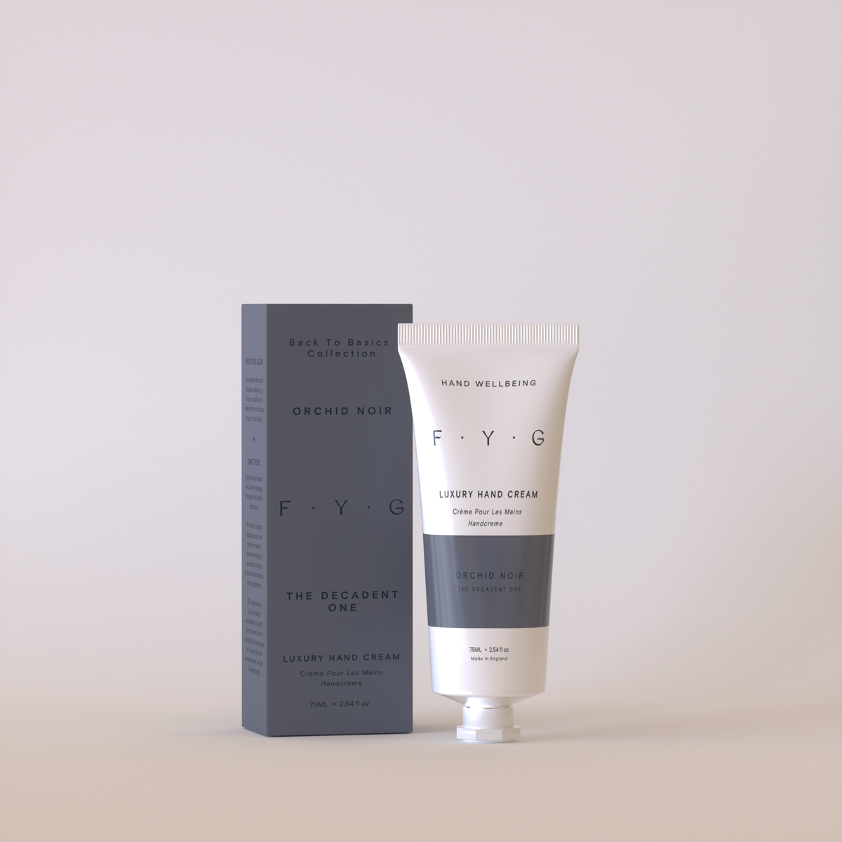 Tube of FYG Orchid Noir luxury hand cream and packaging on a light gray background